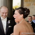 Krissi's laughing seeing the best man drop the wedding ring.